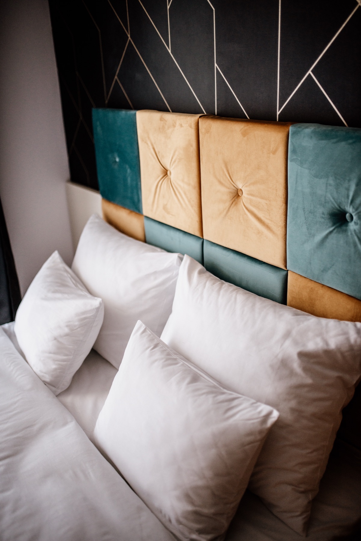 Bedroom with neutral tones and layered lighting